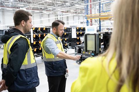 Mirko Bührmann explains how the paperless supermarket works. (Image- Volkswagen:Marc Sluiter)